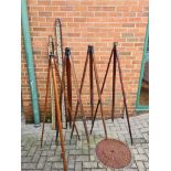 A Collection of Surveyors Tripods and Staffs,