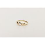 A Precious Yellow Metal Claddagh Style Dolphin Ring,