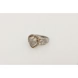 A Silver and Diamond Heart Shaped Dress Ring,