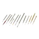 Three Gold-Cased Toothpicks with a Collection of Silver Toothpicks,