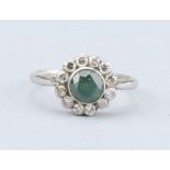 An Art Deco Diamond and Emerald Platinum Cluster Ring,