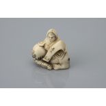 A Meiji Period Ivory Netsuke of Karako on a Resting Elephant,