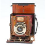 A Sanderson Regular Model Hand & Stand Quarter Plate Camera,
