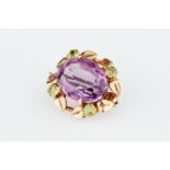 An Edwardian Oval Cut Amethyst Brooch,