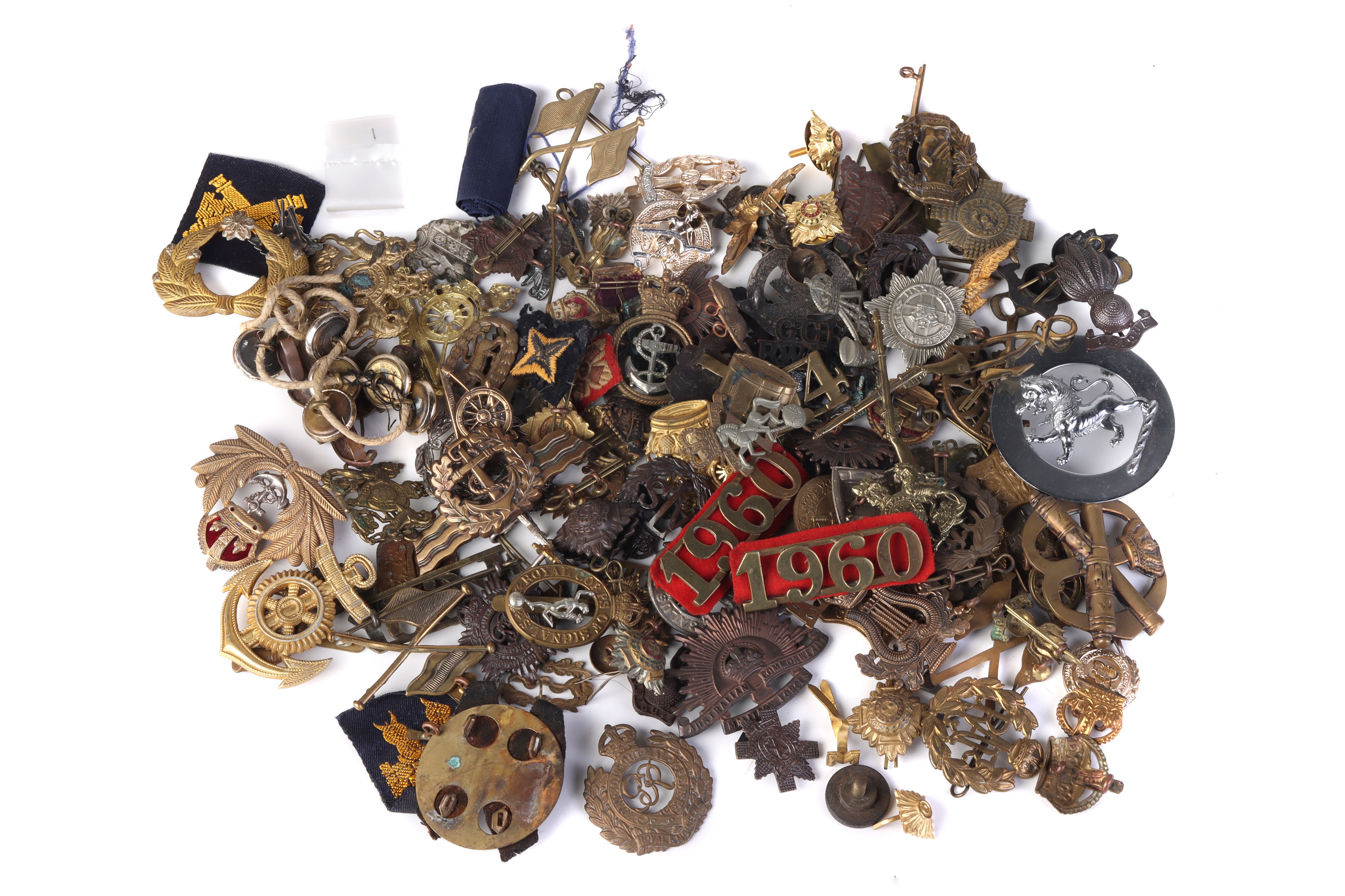 A Good Collection of WWI & WWII Military Cap Badges,