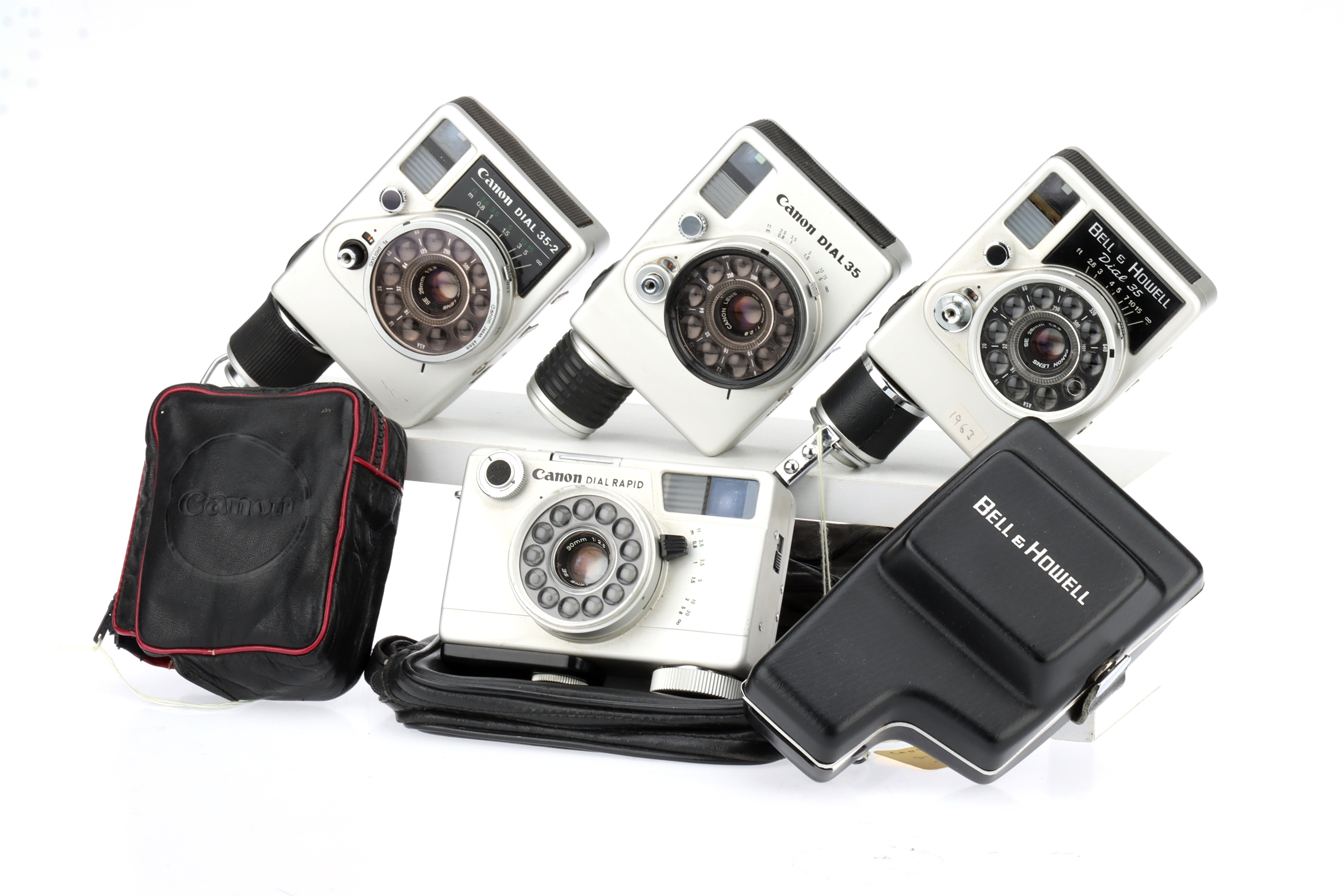 Four Canon Dial 35 Style Half Frame 35mm Compact Cameras,