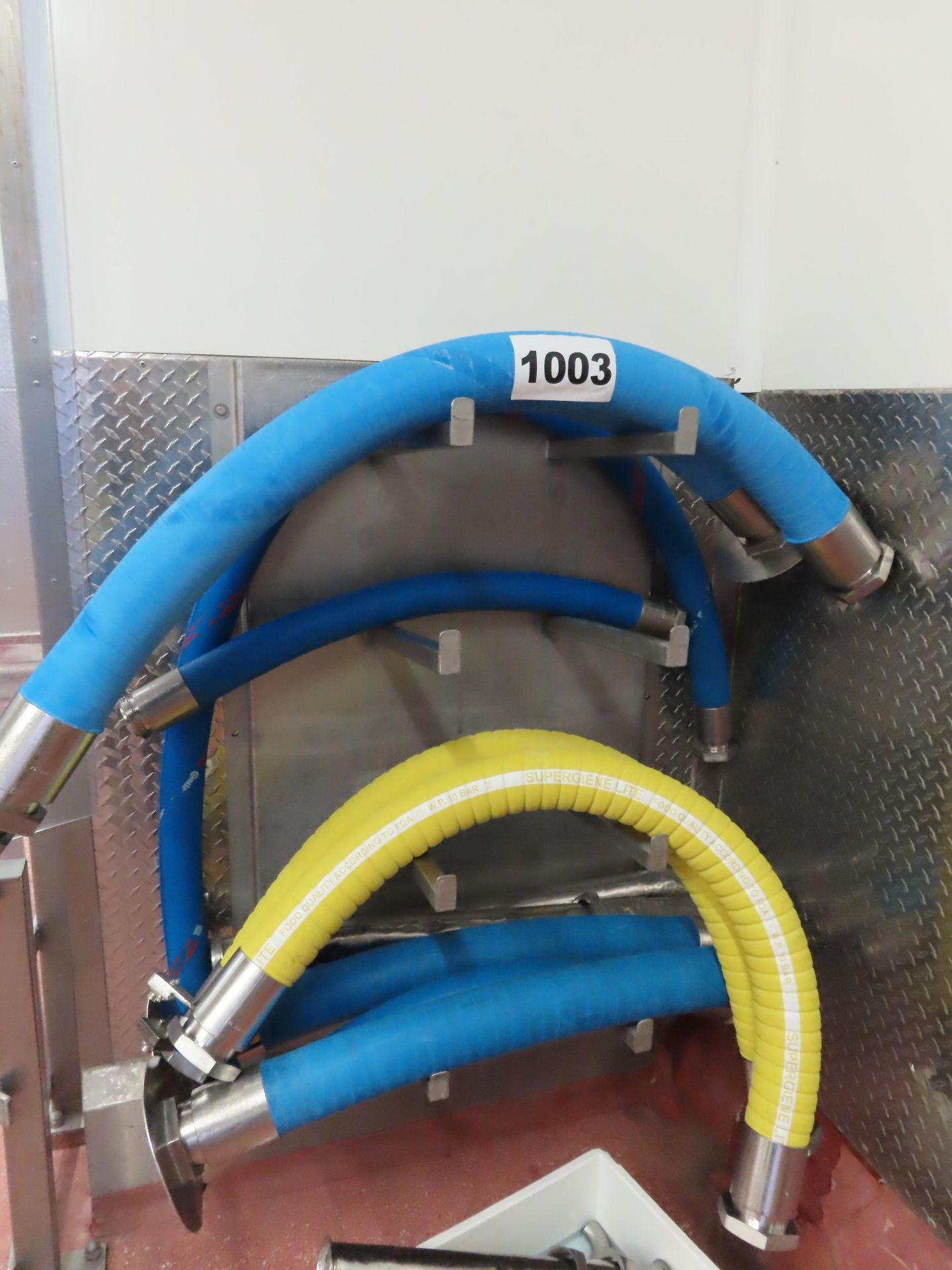 WALL MOUNTED HOSE HOLDER AND HOSES.