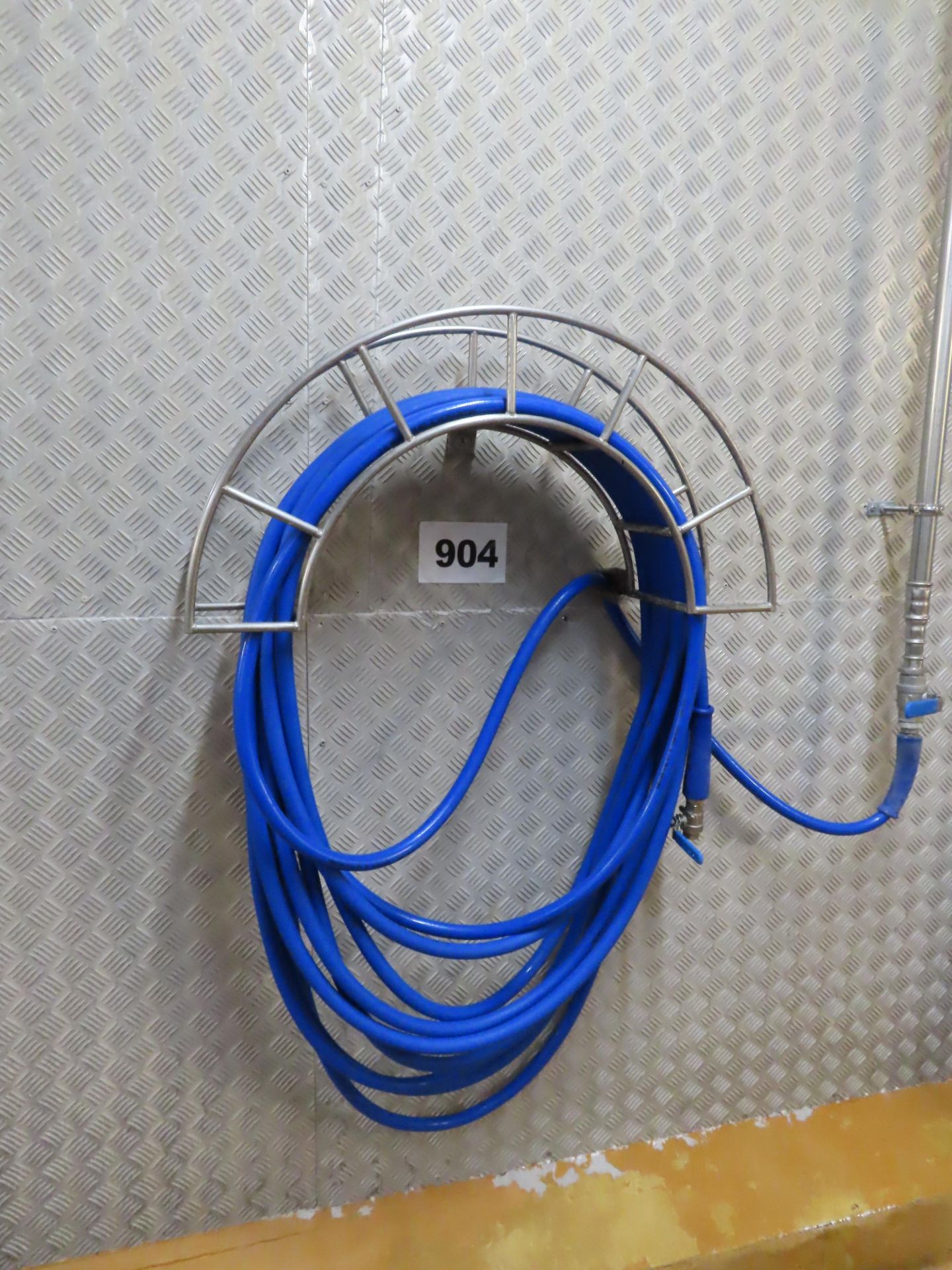 WALL MOUNTED HOSE RELL AND HOLDER.