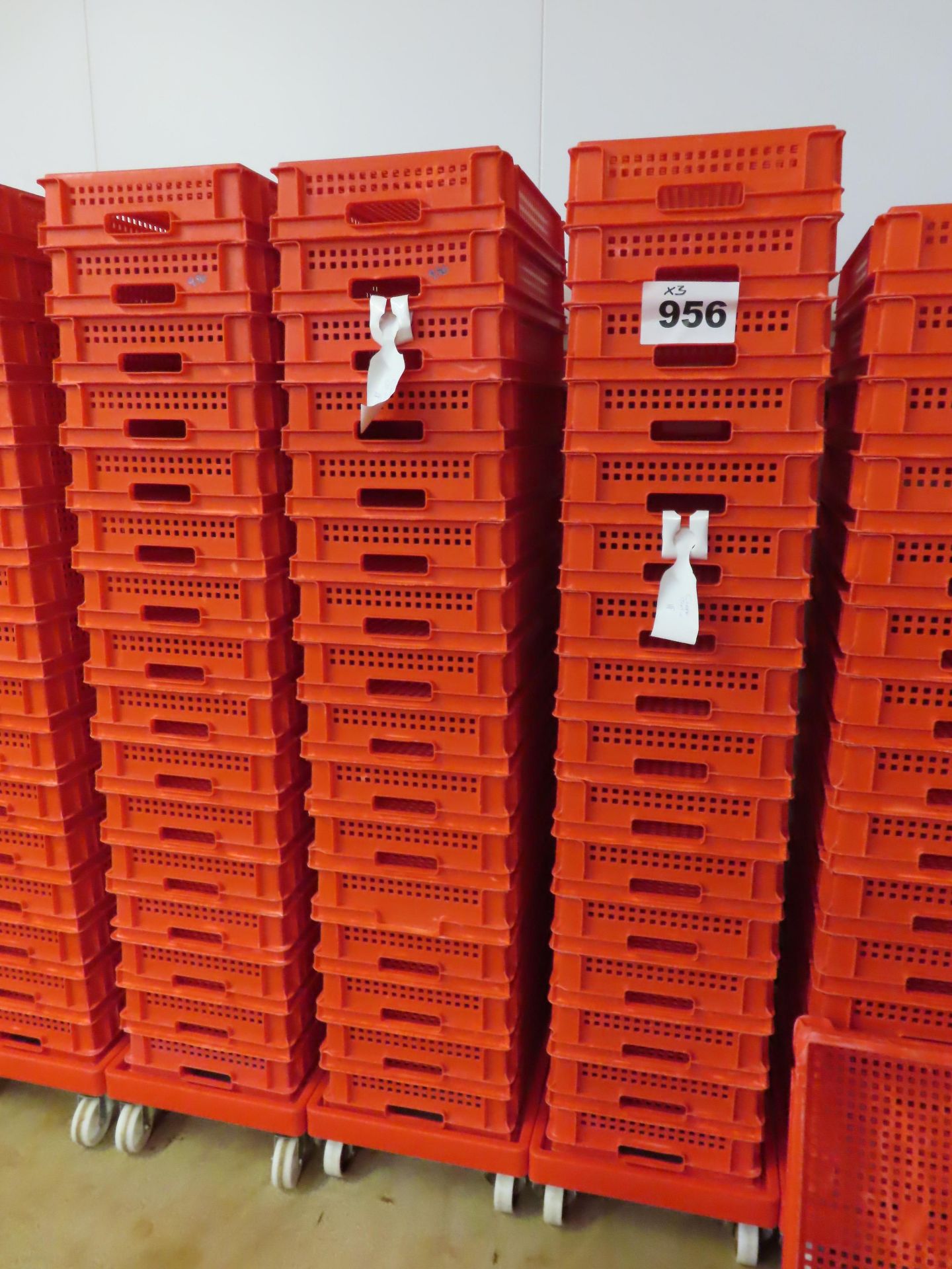 3 X DOLLIES HOLDING QTY RED PERFORATED TRAYS.16 trays per dolly. 48 trays