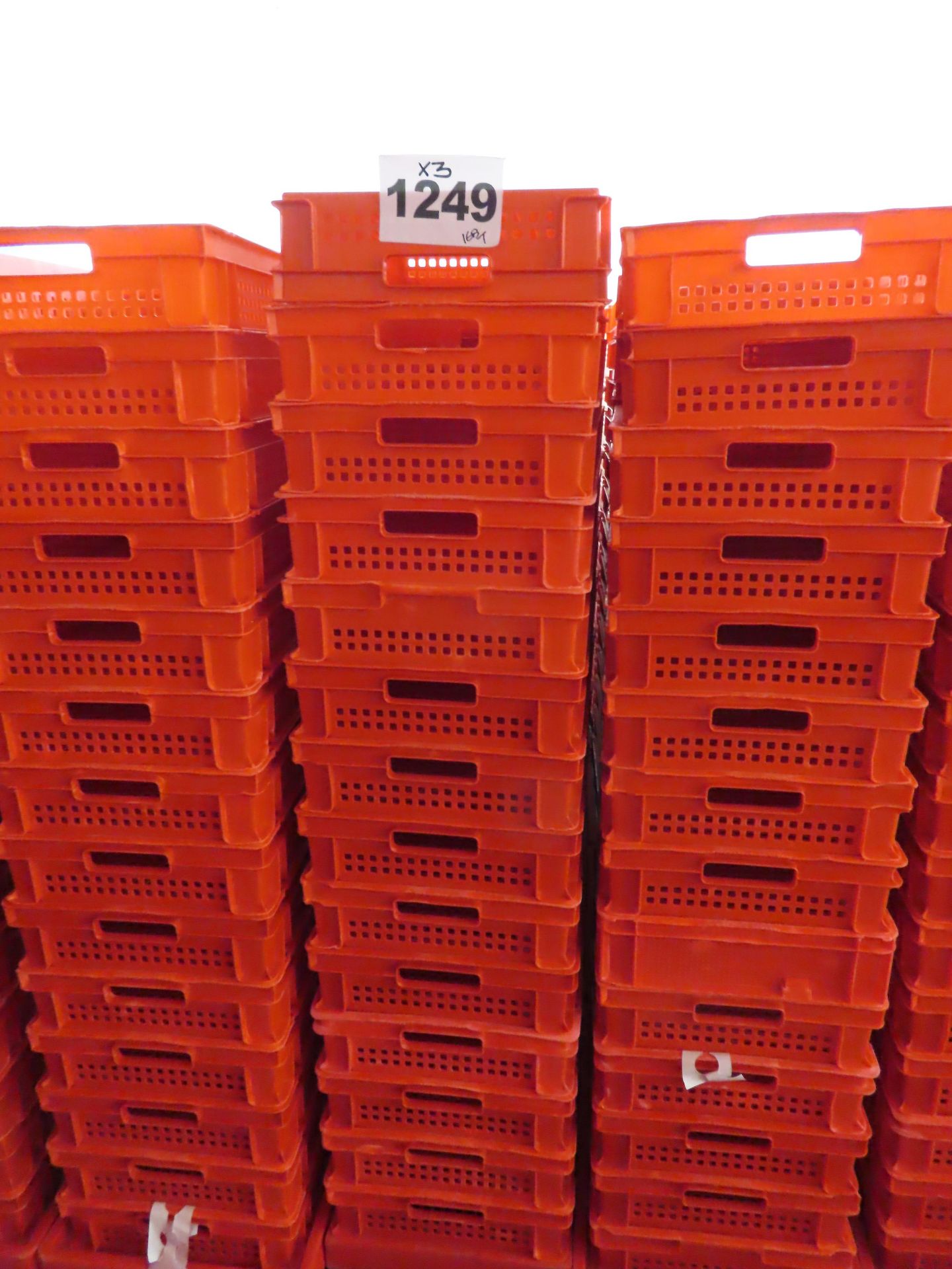 12 X STACKS OF 14 RED PERFORATED TRAYS.