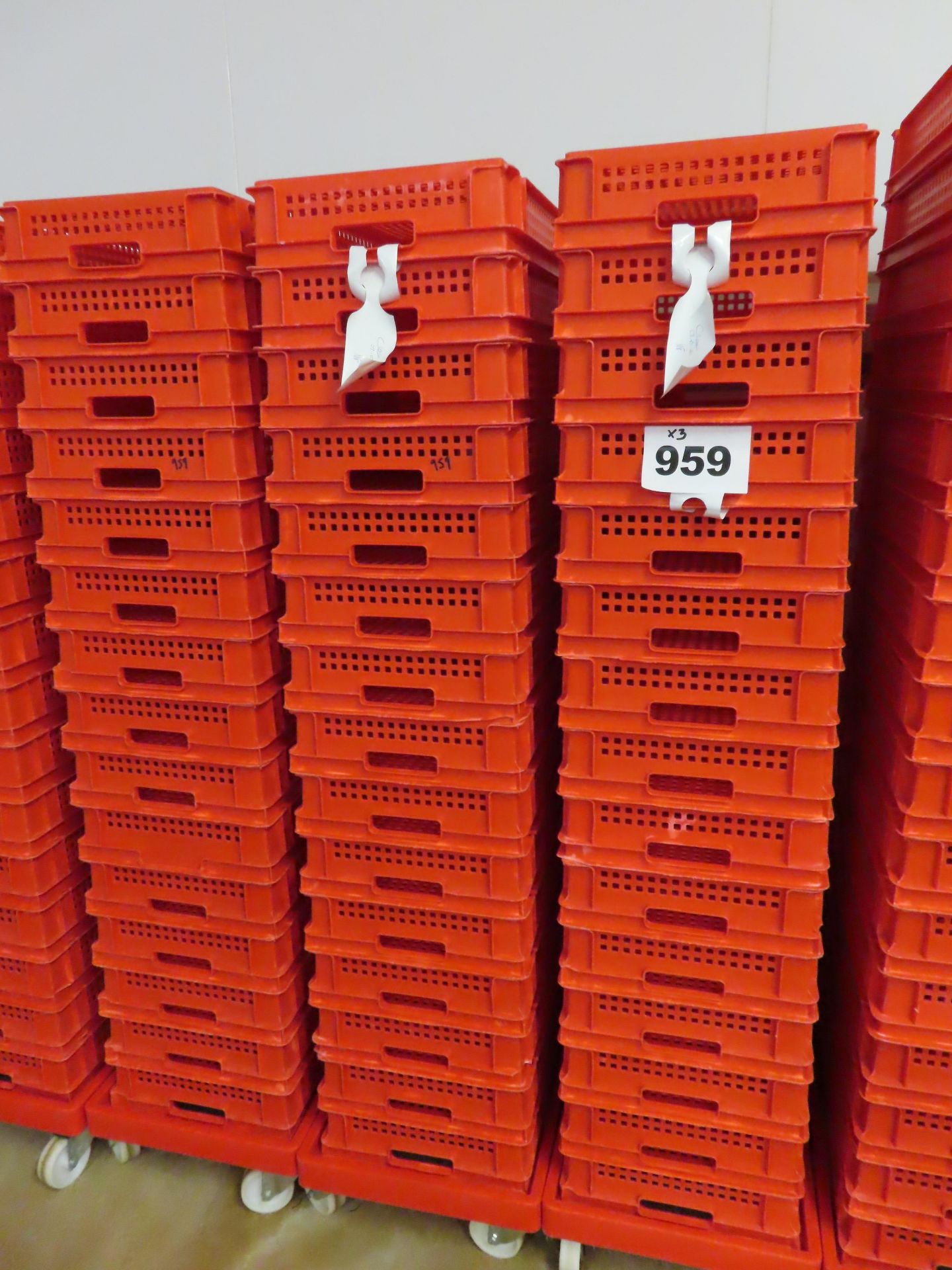 3 X DOLLIES HOLDING QTY RED PERFORATED TRAYS.16 trays per dolly. 48 trays
