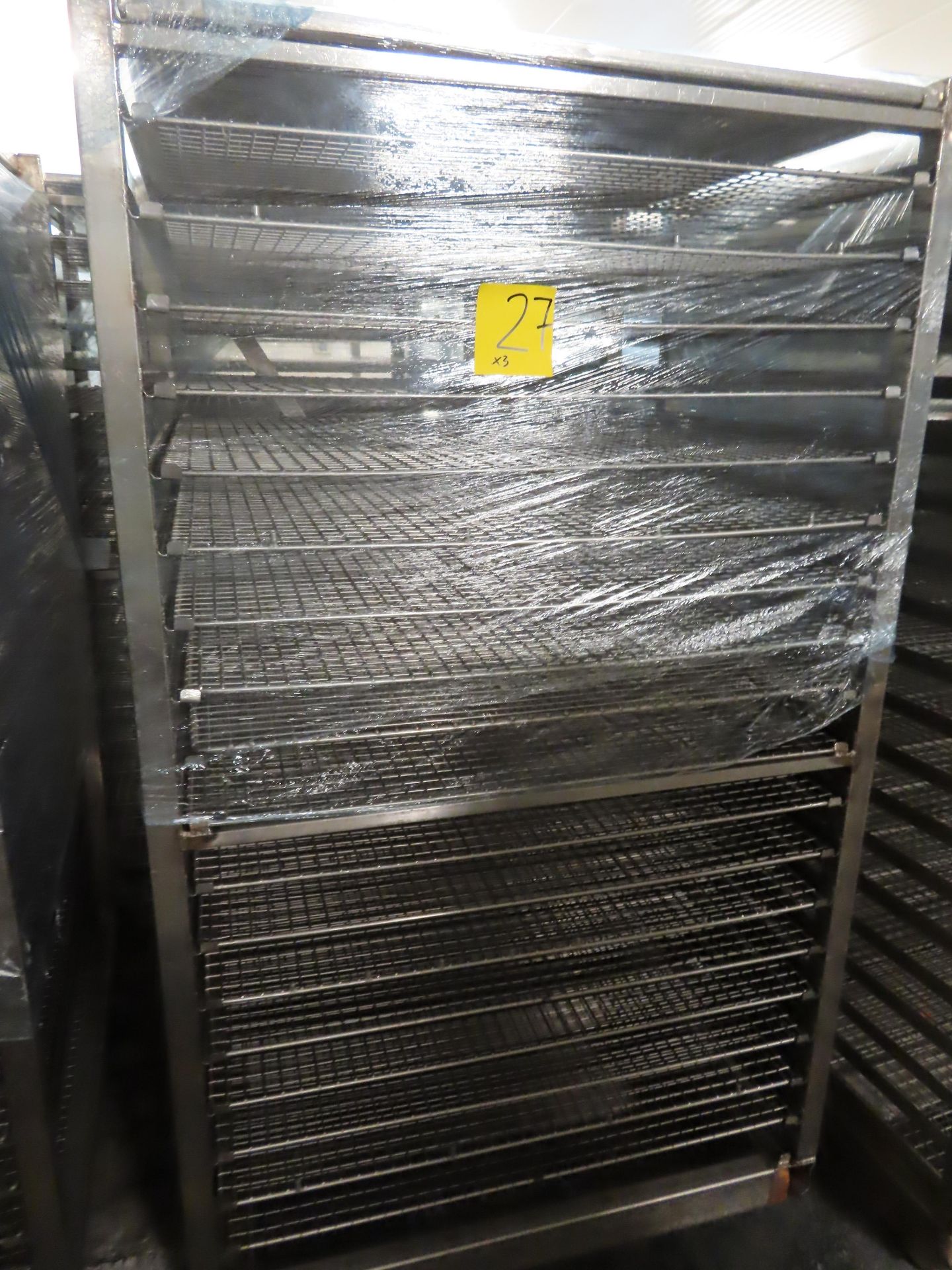 3 X S/S TROLLEYS WITH PERFORATED TRAYS. (57 TRAYS)