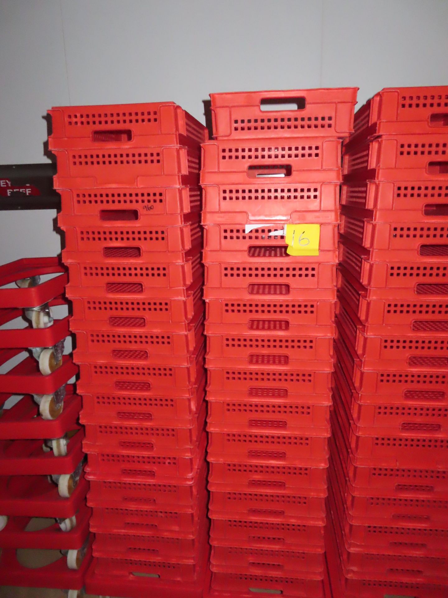 3 X DOLLIES WITH 48 RED PERFORATED TRAYS.