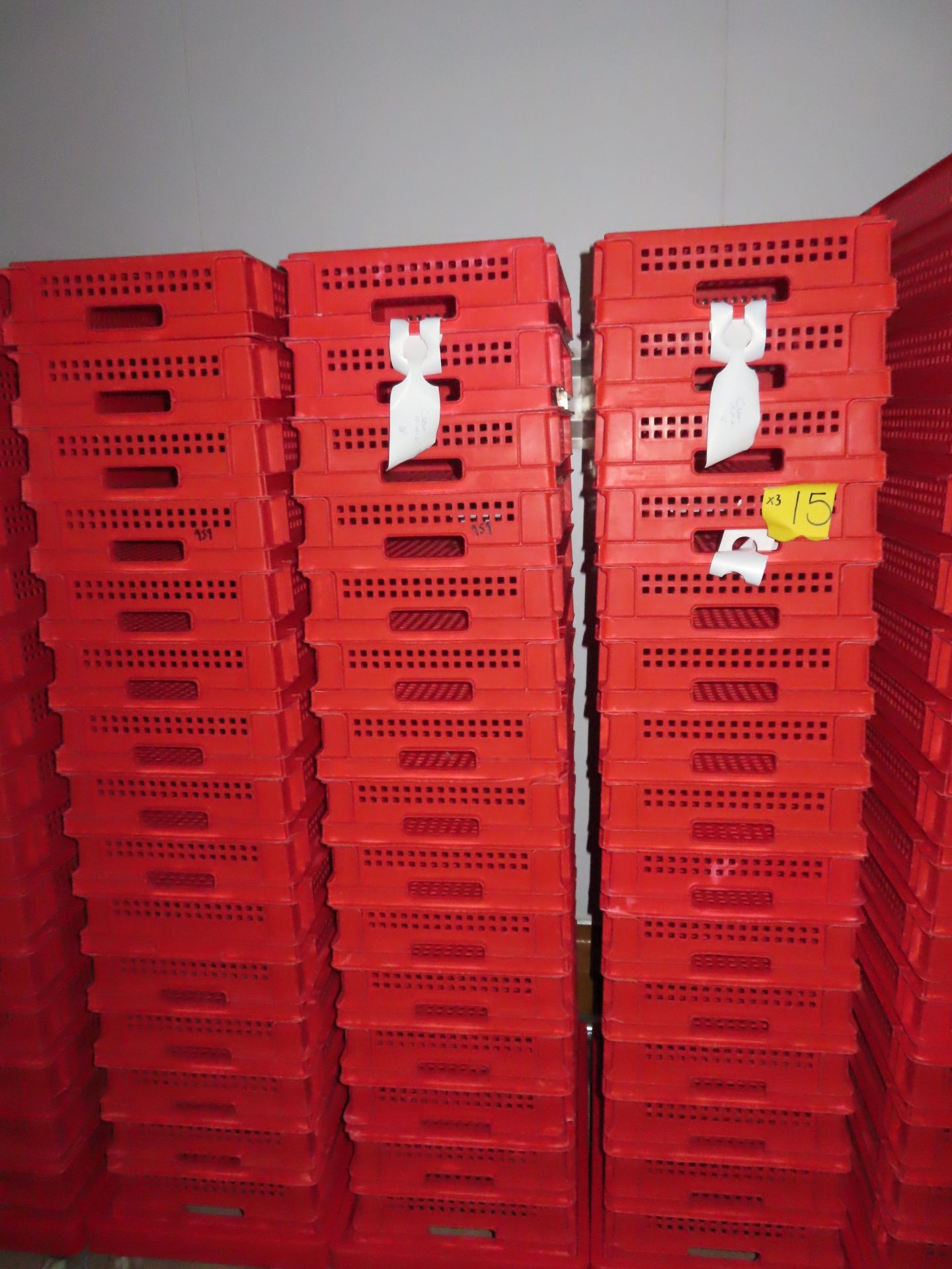 3 X DOLLIES WITH 48 RED PERFORATED TRAYS.