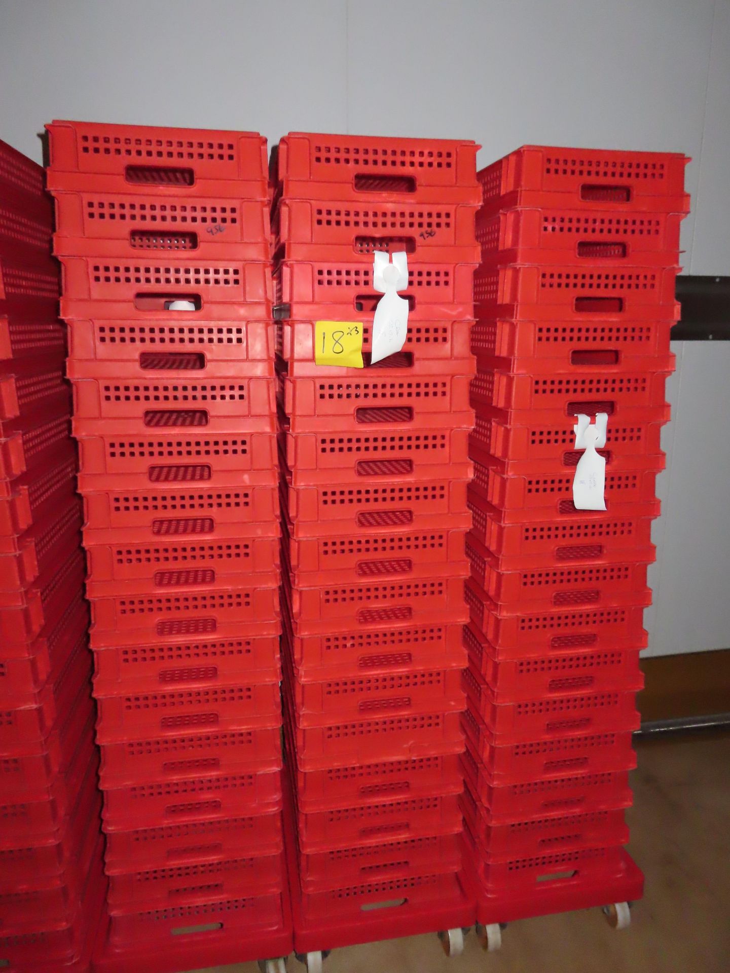 3 X DOLLIES WITH 48 RED PERFORATED TRAYS.