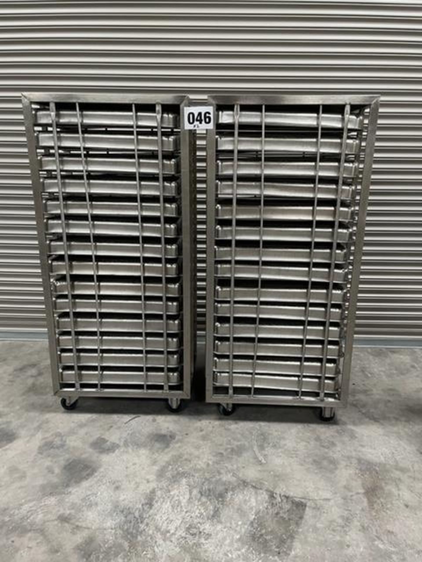 2 X UNITECH S/S RACKS COMPLETE WITH 14 GASTRO TRAYS IN EACH RACK.