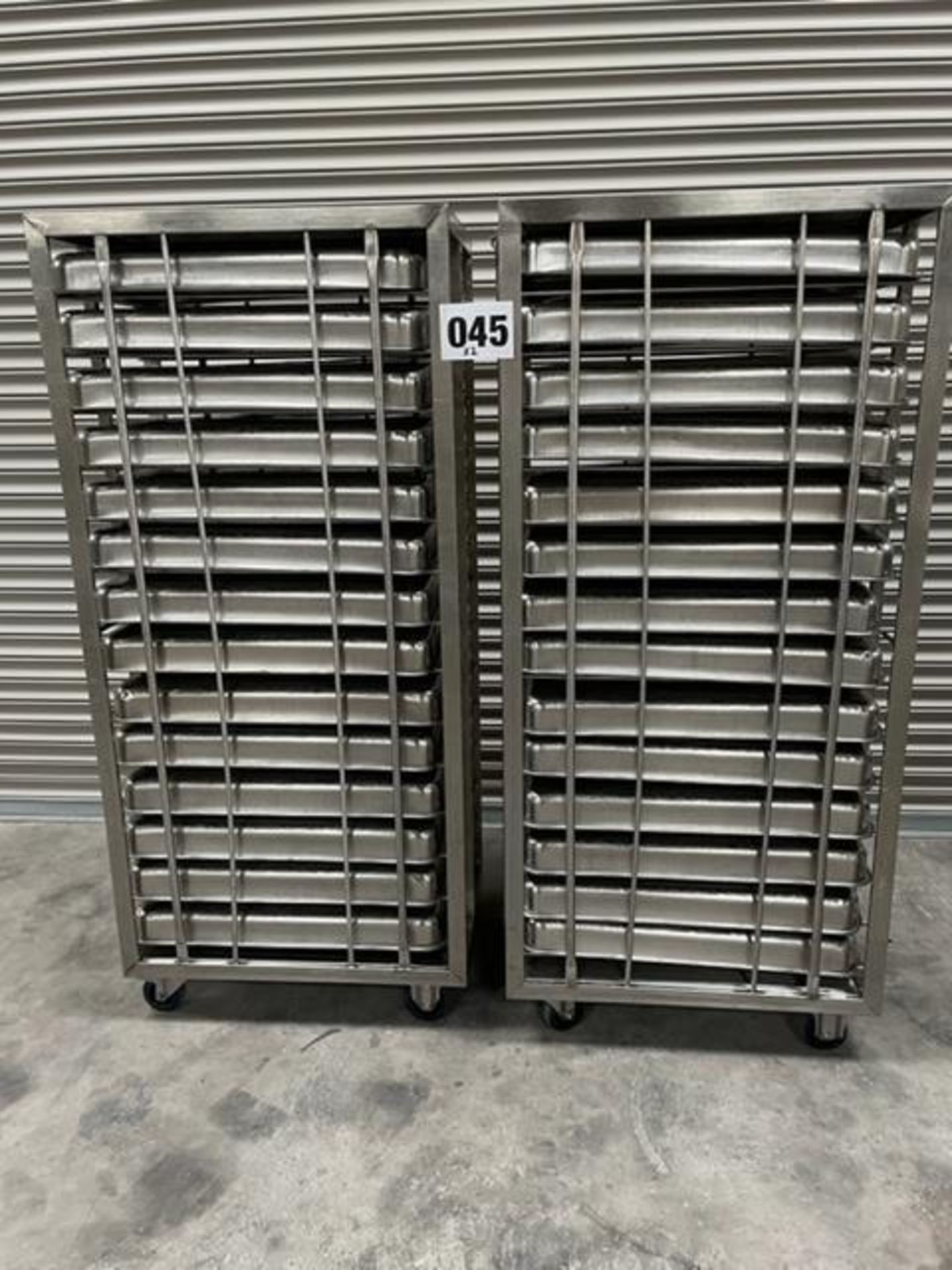 2 X UNITECH S/S RACKS COMPLETE WITH 14 GASTRO TRAYS IN EACH RACK.