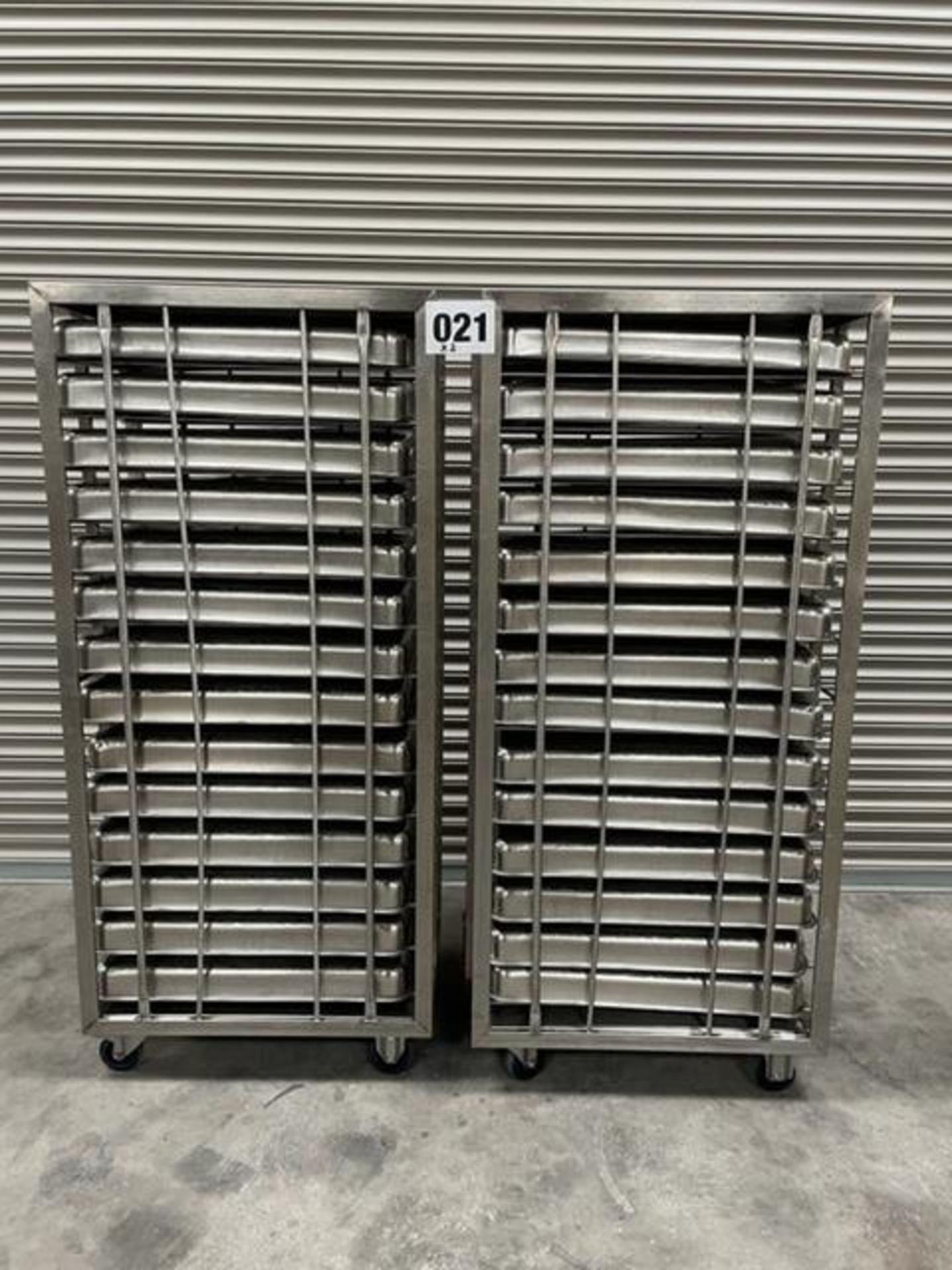 2 X UNITECH S/S RACKS COMPLETE WITH 14 GASTRO TRAYS IN EACH RACK.