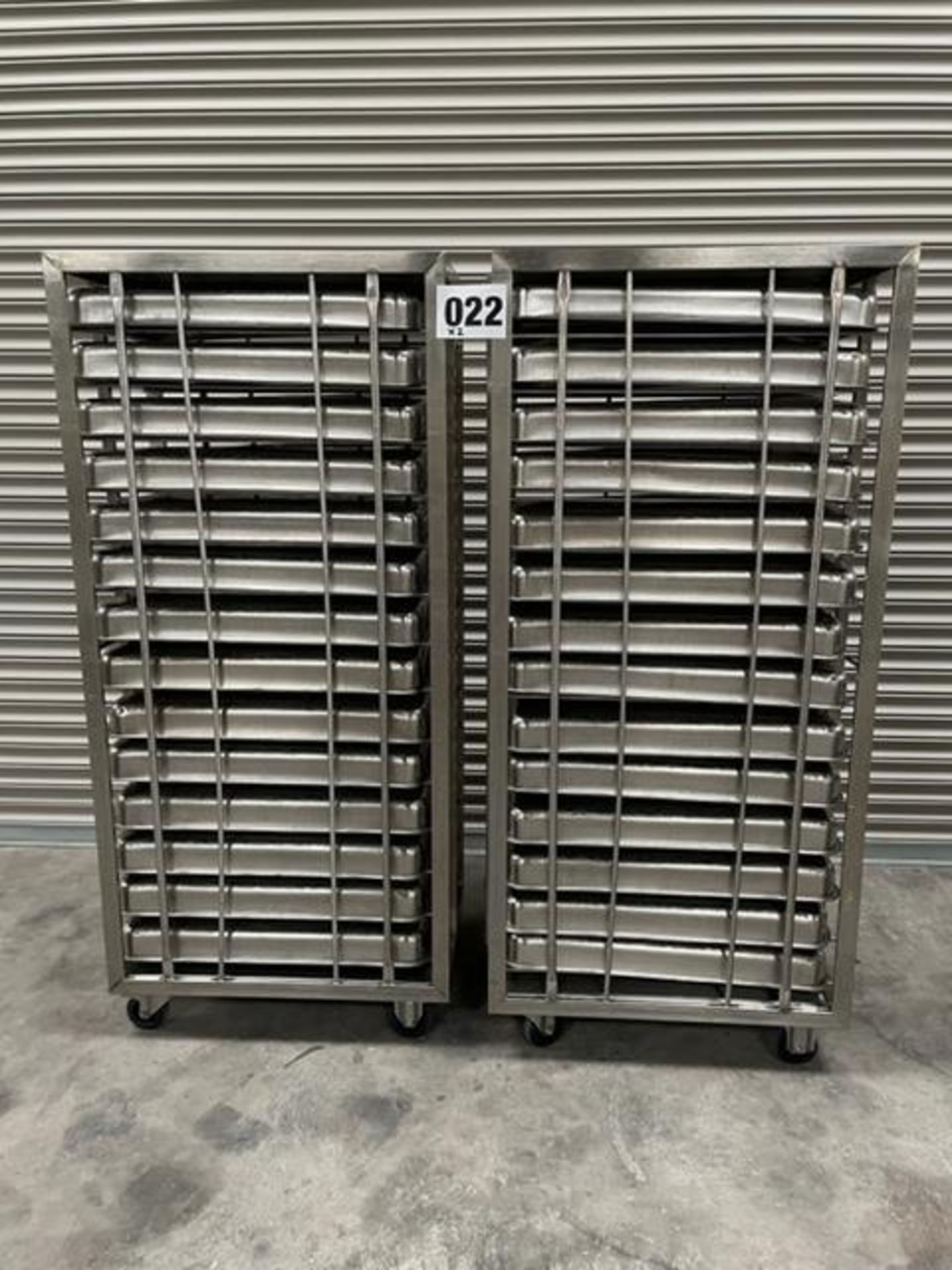 2 X UNITECH S/S RACKS COMPLETE WITH 14 GASTRO TRAYS IN EACH RACK.