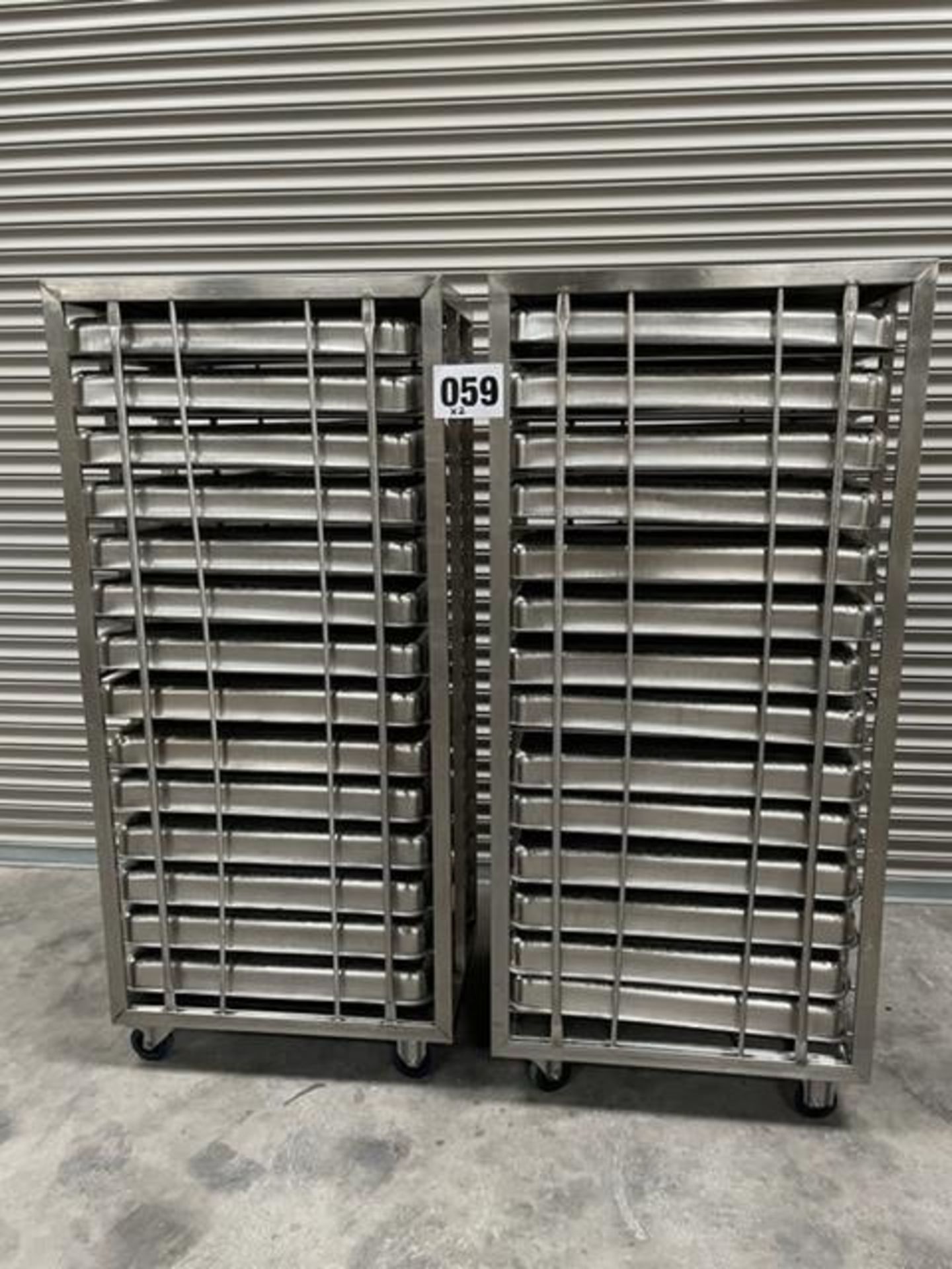 2 X UNITECH S/S RACKS COMPLETE WITH 14 GASTRO TRAYS IN EACH RACK