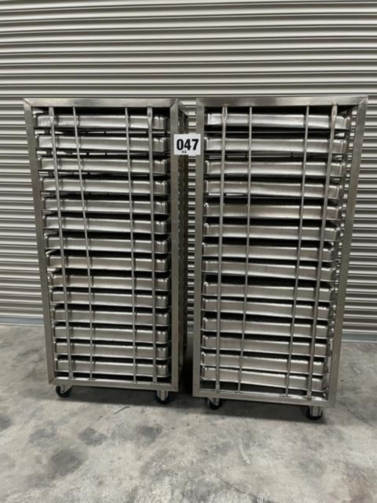2 X UNITECH S/S RACKS COMPLETE WITH 14 GASTRO TRAYS IN EACH RACK.