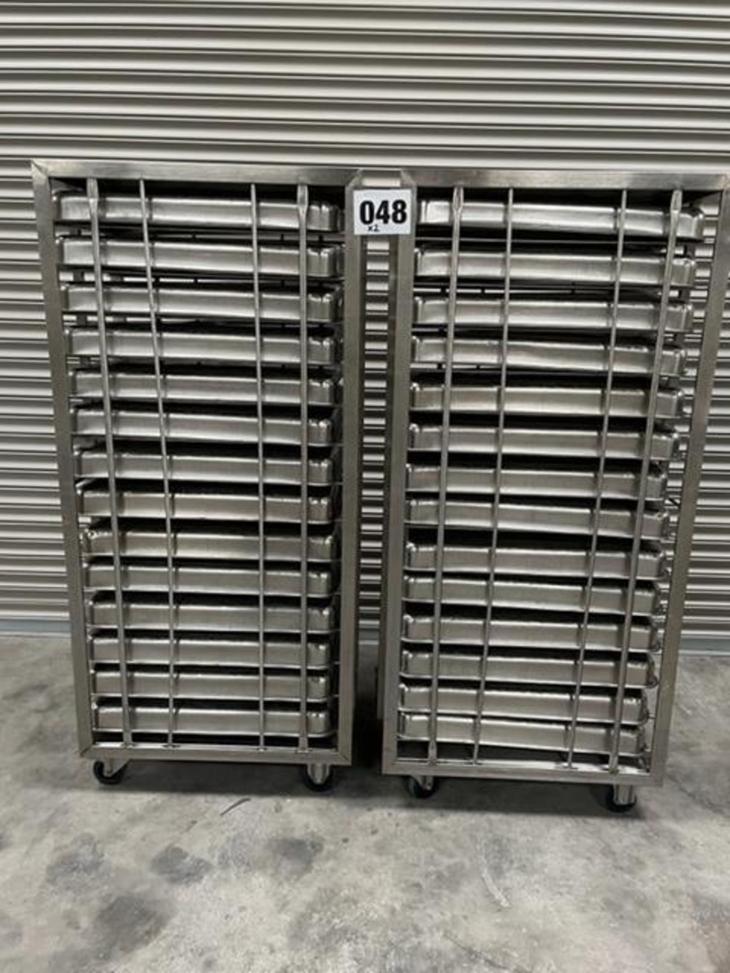 2 X UNITECH S/S RACKS COMPLETE WITH 14 GASTRO TRAYS IN EACH RACK