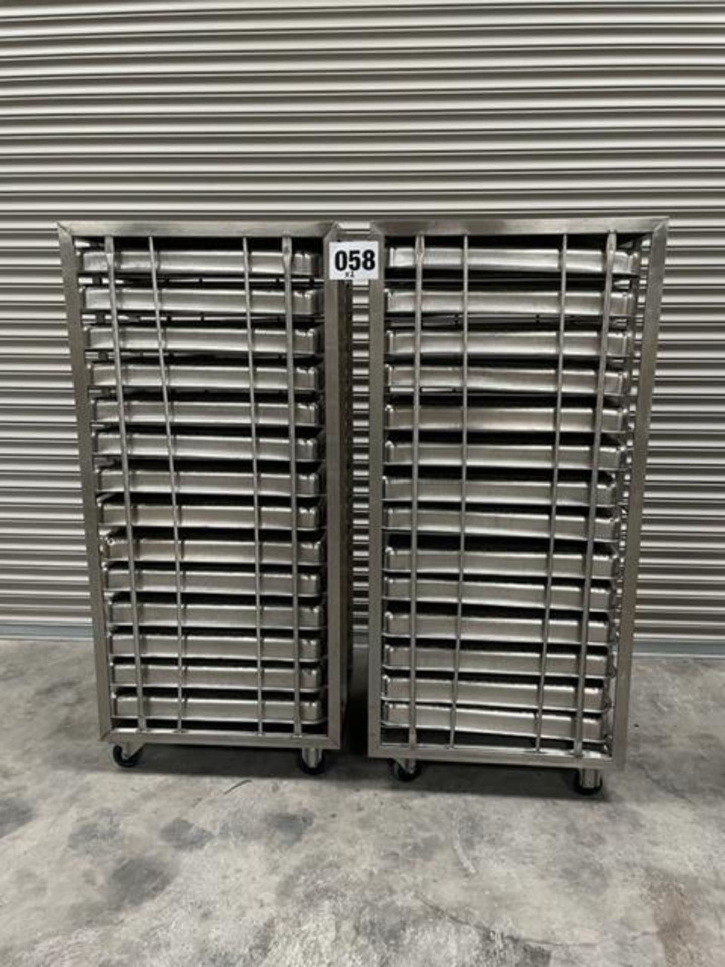 2 X UNITECH S/S RACKS COMPLETE WITH 14 GASTRO TRAYS IN EACH RACK