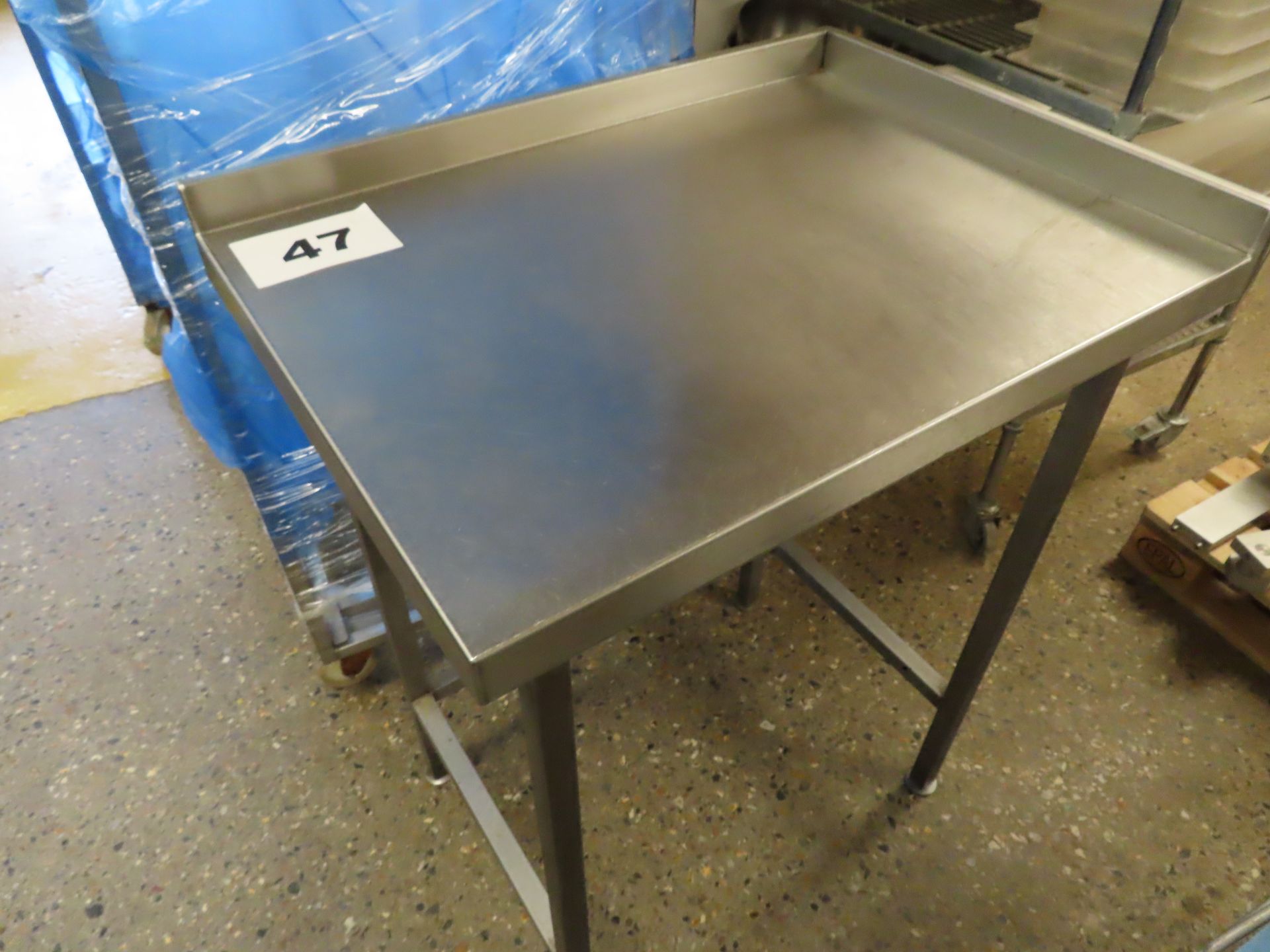 STAINLESS STEEL 3-SIDED LIP TABLE.