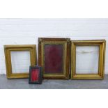 A collection of gilt frames to include one with a velvet surround and a small ebonised showcases