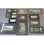 A quantity of early 20th century embroidered landscapes, in glazed frames of various size and shape