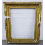 A large giltwood frame, with some loses to the gesso, some lose parts, inner dimension 70 x 90cm