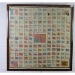 A large silk panel with Flags of World centred by a Royal Standard of the United Kingdom, framed