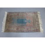 Turkish prayer rug, green field and floral borders, 138 x 86cm
