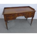 19th century mahogany desk with three quarter ledgeback, rectangular top and four drawers with bun