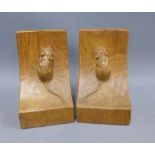 A pair of Robert Mouseman Thompson carved light oak bookends, each carved mouse trademark, 16cm, (2)