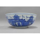 Chinese blue and white porcelain punch bowl with rock work to the inside and with a village scene to