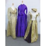 Victorian women's clothing to include a purple silk jacket and skirt, a cream and silk thread floral