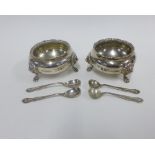 Pair of silver salts, London 1934, with gadrooned rims, lion mask heads and raised on three paw