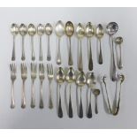 A quantity of 18th and 19th century silver teaspoons, and pickle forks, together with white metal