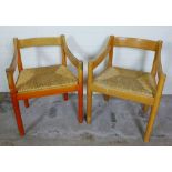 A pair of Vico Magistretti mid century open armchairs with woven rush seats 58 x 76cm (2)