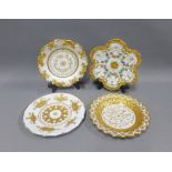 Set of four Dresden floral moulded and heavily gilded plates, with blue crossed swords marks, 22cm