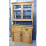 Antique pine kitchen dresser, the glazed with an open back and shelves over two drawers and a pair