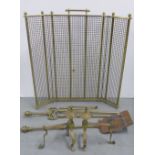 Early 20th century brass three fold spark guard, 68cm high, and brass fire dogs and fireside