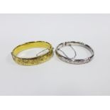 Vintage silver gilt stiff hinged bangle, London 1967, together with another with Birmingham 1977