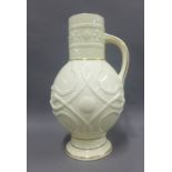 Victorian cream glazed and serpent moulded art pottery jug, 34cm