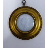 White glass paste portrait relief plaque in a circular gilt frame, paper label verso inscribed '