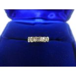18ct white gold and diamond ring, set with a single row of five square diamonds, stamped 750, UK