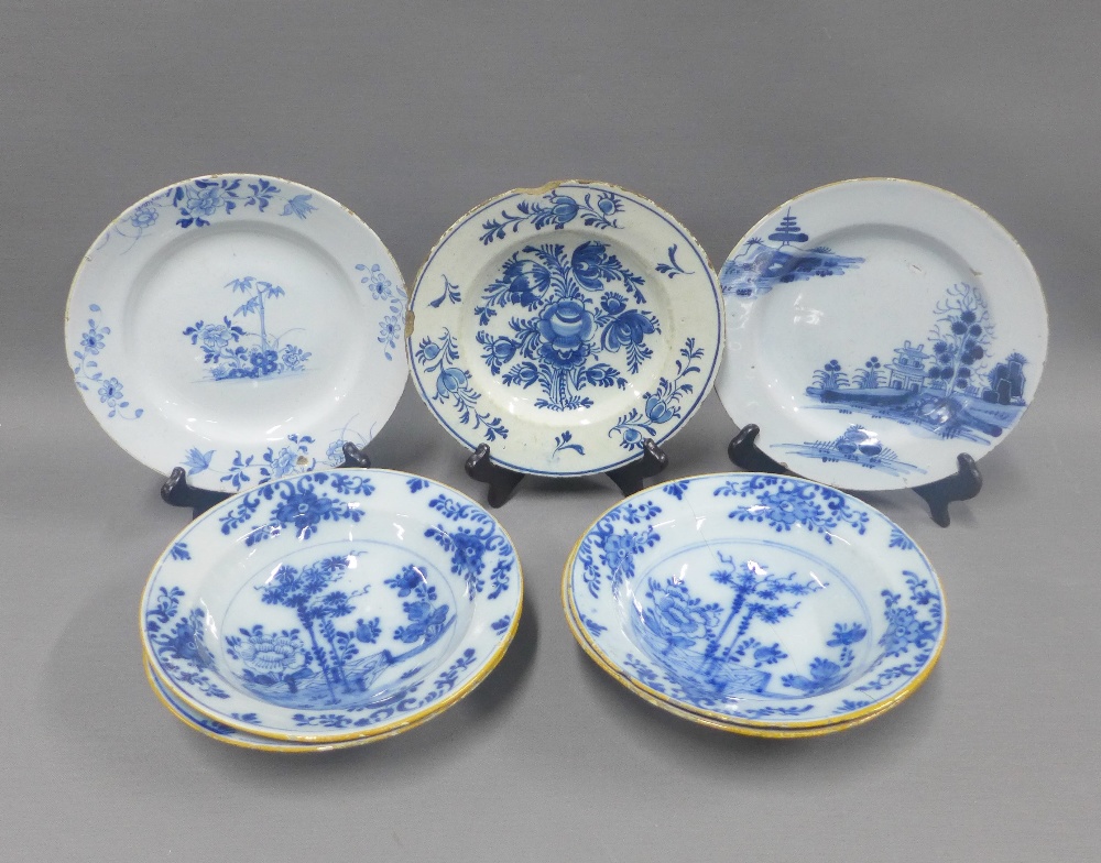 Collection of tin glazed blue and white pottery to include a set of four bowls and three various