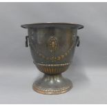 Copper pedestal urn with ring handles and harebell garland pattern, 29cm