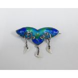 An Art Nouveau style blue and green enamel brooch with three pearl drops, indistinct impressed